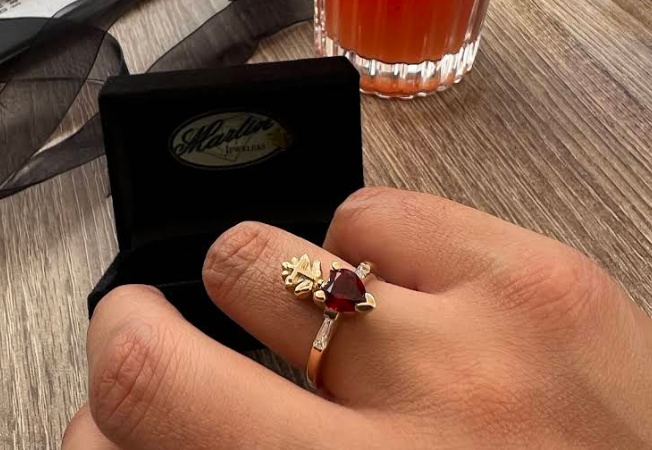 Bespoke ruby trilogy ring presented in a Martin Jewelers box
