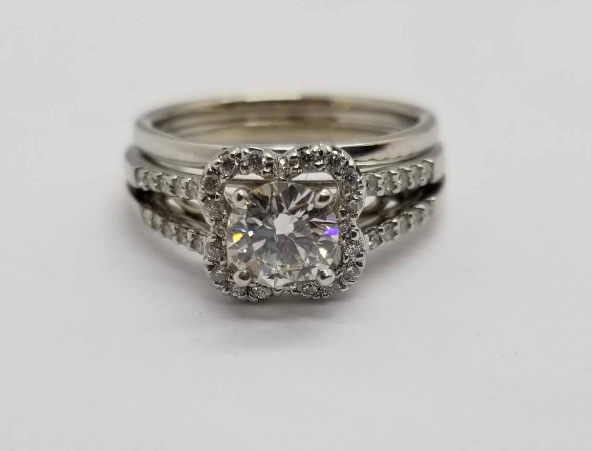 Diamond halo engagement ring with matching pavé band